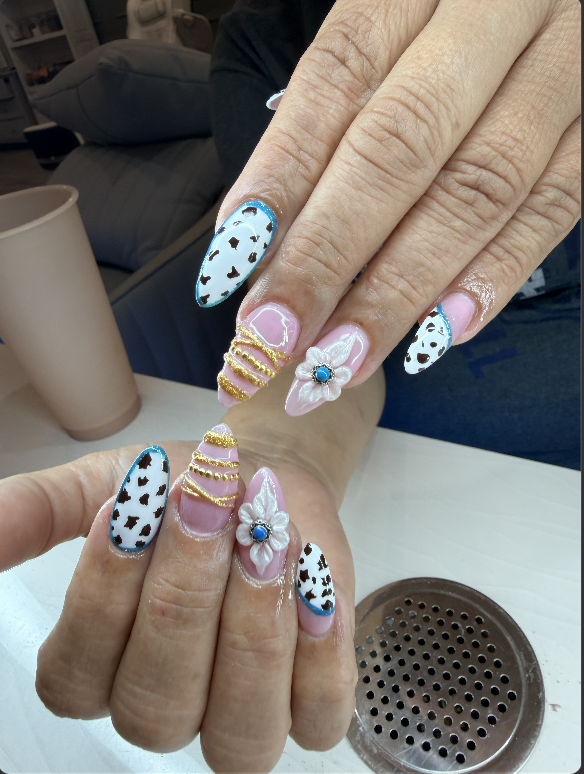 Cow print nails with 3D flower and gold detail