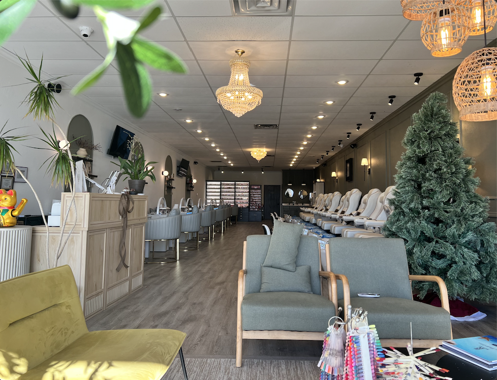 Sunny Nails & Spa interior seating area with woven pendant lights and product display
